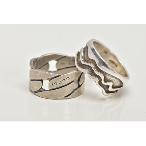 110 - TWO SILVER WIDE BAND RINGS, to include a textured wavy designed wide band, approximate width 11.1mm,... 