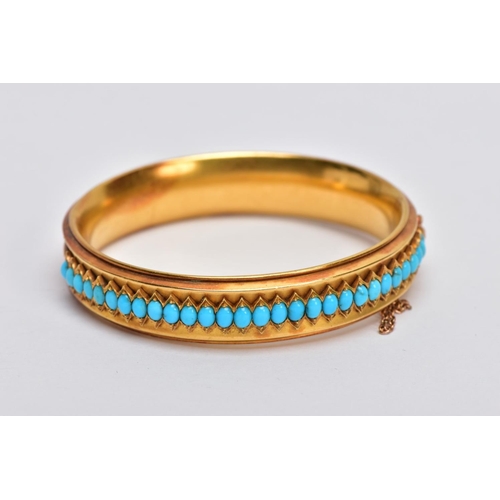 12 - A LATE VICTORIAN TURQUOISE HINGED BANGLE, of slight concave design, the back half with central band ... 