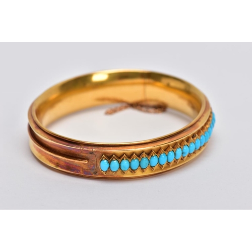 12 - A LATE VICTORIAN TURQUOISE HINGED BANGLE, of slight concave design, the back half with central band ... 