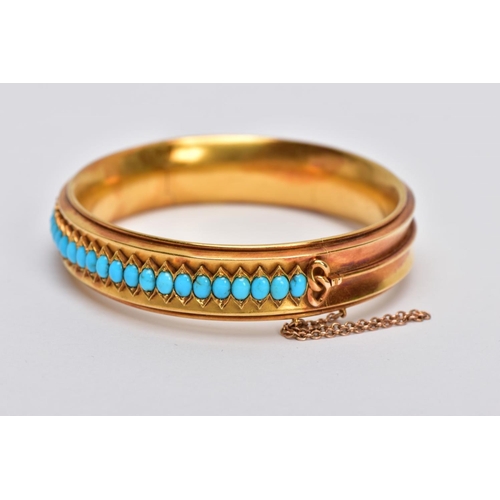 12 - A LATE VICTORIAN TURQUOISE HINGED BANGLE, of slight concave design, the back half with central band ... 