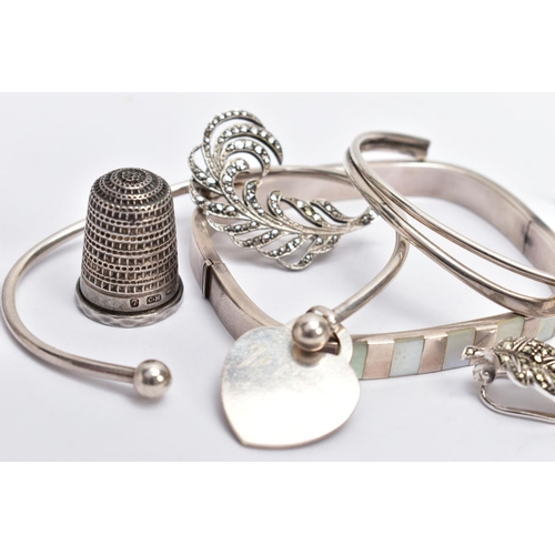 128 - A SELECTION OF ITEMS, to include two silver cuffs each with full hallmarks for Birmingham and Sheffi... 