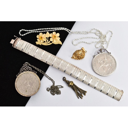 129 - A SILVER BRACELET, COMMEMORATIVE COINS ETC, to include an articulated silver wide bracelet, fitted w... 