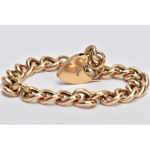 14 - A 9CT GOLD CURB LINK BRACLET, with a heart padlock clasp and safety chain, 9ct hallmark for Birmingh... 