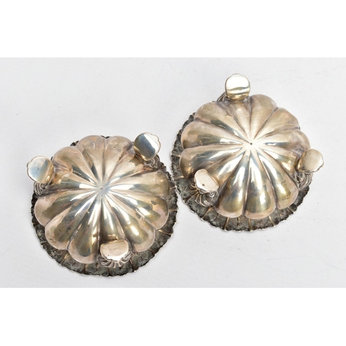 141 - TWO SILVER BONBON DISHES, each with an embossed bowl, worn gilt interior, flower detailed rims, each... 