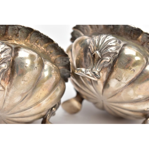 141 - TWO SILVER BONBON DISHES, each with an embossed bowl, worn gilt interior, flower detailed rims, each... 