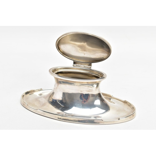 146 - A SILVER INK WELL, of a plain polished oval shape, engraved to the cover 'Presented to Mt.U.Bona, as... 