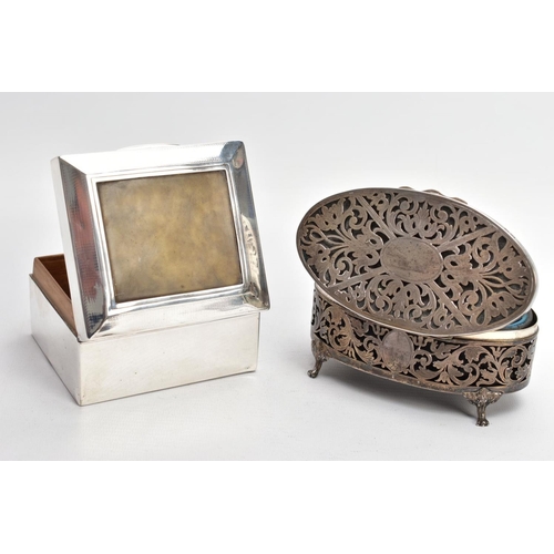 147 - A GEORGE V SILVER LINED, SQUARE CIGARETTE BOX AND A PIERCED OVAL VANITY BOX, engine turned design se... 