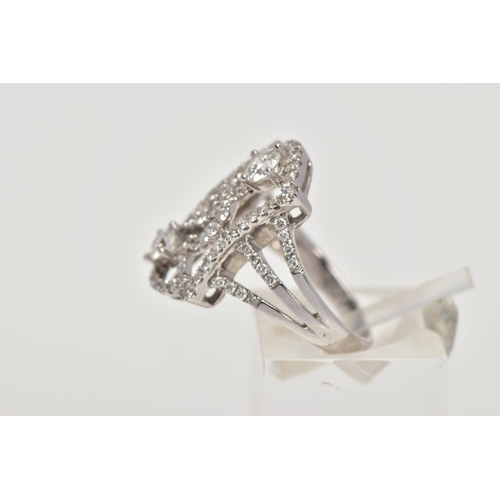 170 - A MODERN DIAMOND FANCY RING, designed as an open rectangular head of scroll design with two larger m... 