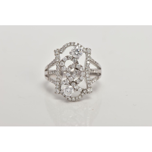 170 - A MODERN DIAMOND FANCY RING, designed as an open rectangular head of scroll design with two larger m... 