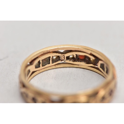 184 - A 9CT GOLD GARNET AND SPINEL FULL ETERNITY RING, set with circular cut garnets flanked by colourless... 