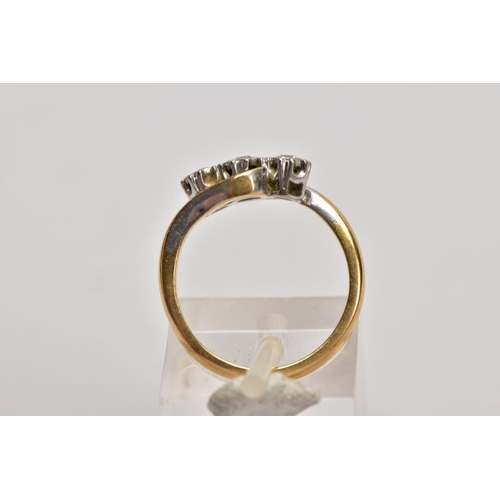 185 - A YELLOW METAL THREE STONE DIAMOND RING, designed with three graduated round brilliant cut diamonds,... 