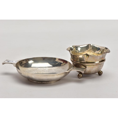 186 - TWO SILVER BONBON DISHES, the first a George V dish, of a plain polished circular form, double handl... 