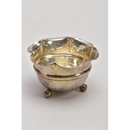 186 - TWO SILVER BONBON DISHES, the first a George V dish, of a plain polished circular form, double handl... 