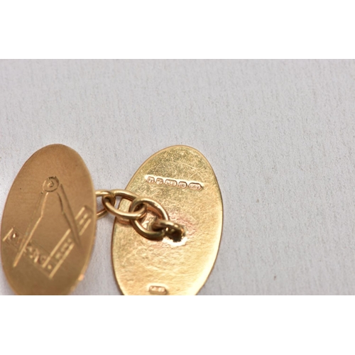 187 - A SINGLE 9CT GOLD CUFFLINK AND YELLOW METAL ITEMS, the cufflink with and engraved masonic design, ha... 