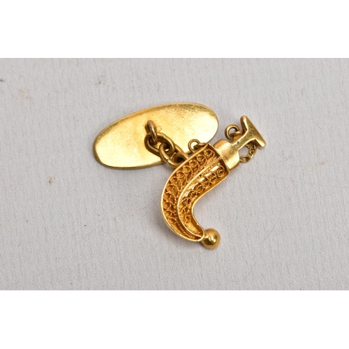 188 - A PAIR OF YELLOW METAL NOVLETY ARABIC CUFFLINKS, each in the form of a sheath and removeable dagger ... 