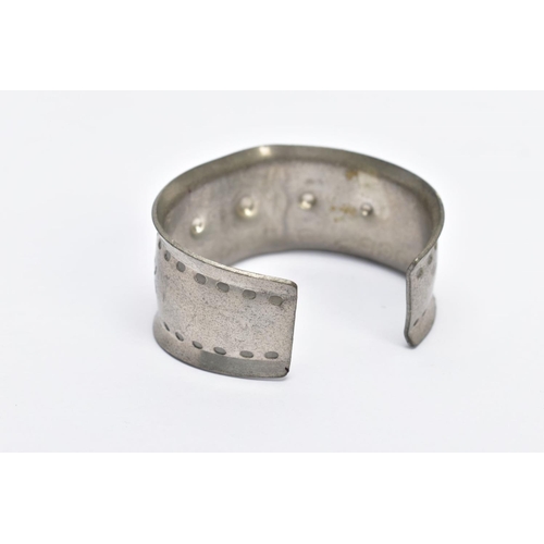 21 - A PEWTER 'JORGEN JENSEN' BANGLE, handmade bangle with a beaded design, signed 'Jorgen Jensen, Denmar... 