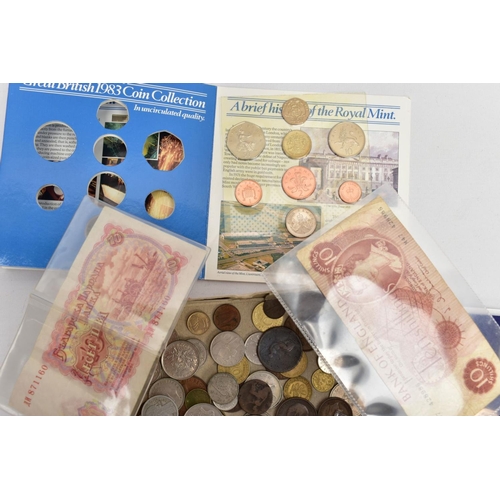 210 - A CARDBOARD BOX OF MIXED COINAGE to include a proof 1982 UK & N Ireland year set, a 1983 UK year set... 