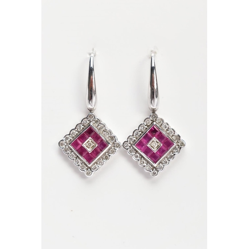 22 - A PAIR OF WHITE METAL, DIAMOND AND RUBY DROP EARRINGS, each drop of a diamond shape, set with square... 