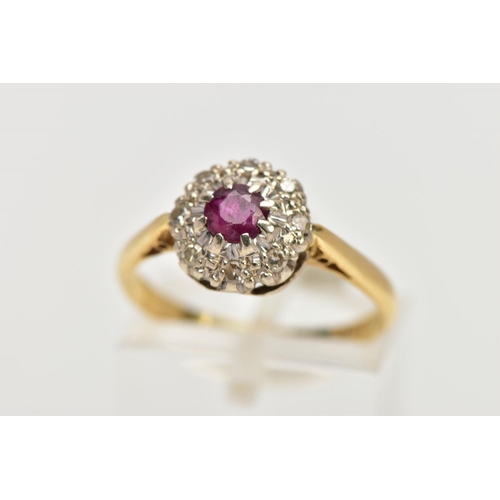 3 - AN 18CT GOLD RUBY AND DIAMOND CLUSTER RING, centring on a circular cut ruby, within a single cut dia... 