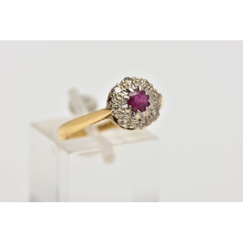 3 - AN 18CT GOLD RUBY AND DIAMOND CLUSTER RING, centring on a circular cut ruby, within a single cut dia... 