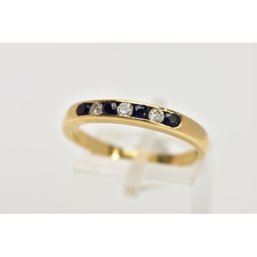 30 - AN 18CT GOLD SAPPHIRE AND DIAMOND HALF ETERNITY RING, designed with a row of channel set circular cu... 