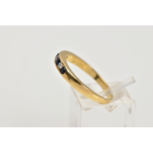 30 - AN 18CT GOLD SAPPHIRE AND DIAMOND HALF ETERNITY RING, designed with a row of channel set circular cu... 