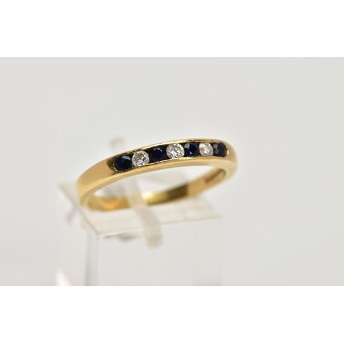 30 - AN 18CT GOLD SAPPHIRE AND DIAMOND HALF ETERNITY RING, designed with a row of channel set circular cu... 