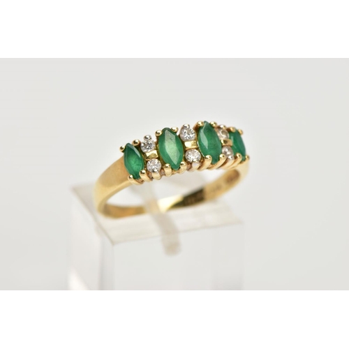 31 - A YELLOW METAL EMERALD AND DIAMOND HALF ETERNITY RING, designed with a row of four marquise cut emer... 