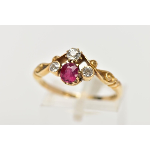 33 - A YELLOW METAL RUBY AND DIAMOND DRESS RING, designed with a cushion cut ruby, flanked with old cut d... 