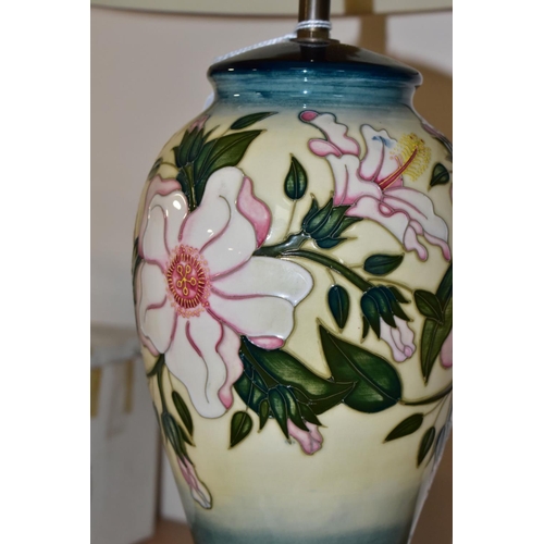 332 - A MOORCROFT POTTERY TABLE LAMP IN THE HIBISCUS MOON PATTERN BY SIAN LEAPER, baluster shaped lamp bas... 