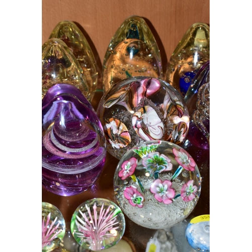 351 - A GROUP OF SEVENTEEN MODERN GLASS PAPERWEIGHTS AND ORNAMENTS, mostly unbranded and of conical shape ... 