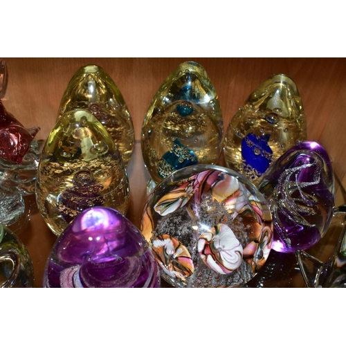 351 - A GROUP OF SEVENTEEN MODERN GLASS PAPERWEIGHTS AND ORNAMENTS, mostly unbranded and of conical shape ... 