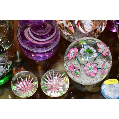 351 - A GROUP OF SEVENTEEN MODERN GLASS PAPERWEIGHTS AND ORNAMENTS, mostly unbranded and of conical shape ... 