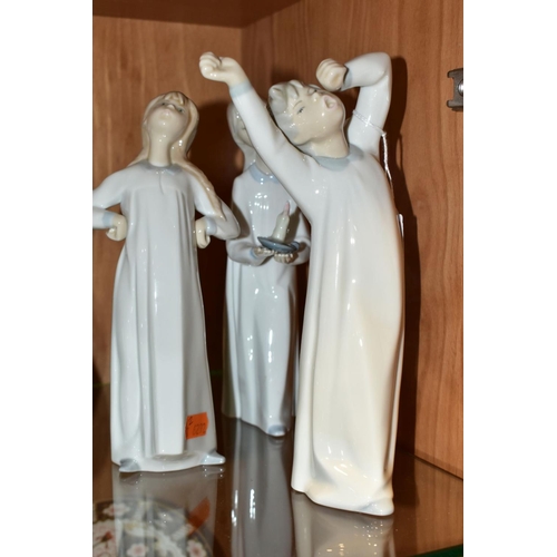 359 - THREE LLADRO FIGURES OF CHILDREN WEARING NIGHT DRESSES, comprising Nos 4868 'Girl with Candle', 4870... 