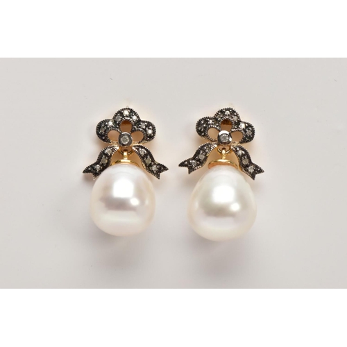 36 - A PAIR OF YELLOW METAL, CULTURED PEARL AND DIAMOND DROP EARRINGS, each designed with bow shaped susp... 