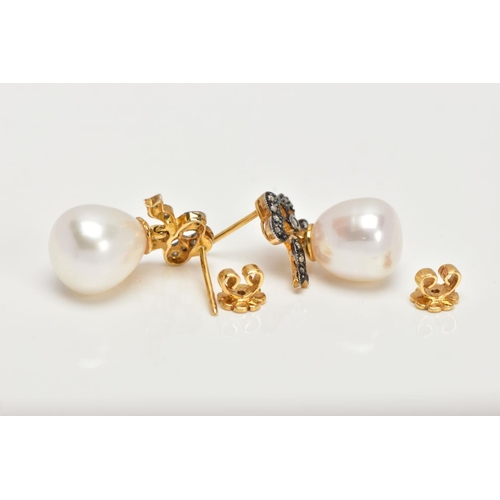 36 - A PAIR OF YELLOW METAL, CULTURED PEARL AND DIAMOND DROP EARRINGS, each designed with bow shaped susp... 