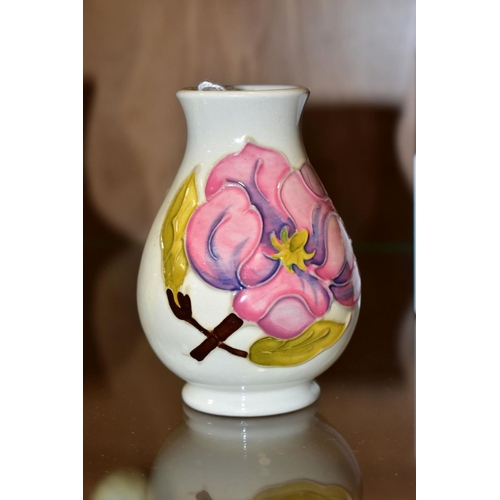 361 - A SMALL MOORCROFT POTTERY VASE, magnolia pattern on cream ground, impressed backstamp, height 9.5cm ... 