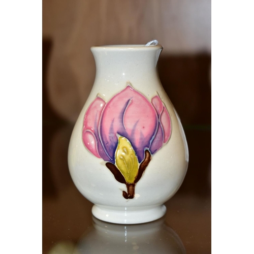 361 - A SMALL MOORCROFT POTTERY VASE, magnolia pattern on cream ground, impressed backstamp, height 9.5cm ... 