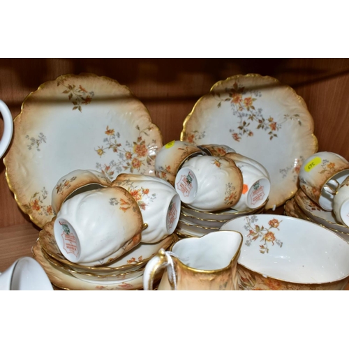 369 - AN EARLY 20TH CENTURY M. REDON LIMOGES PORCELAIN TEA SET, blush ivory ground printed with floral spr... 