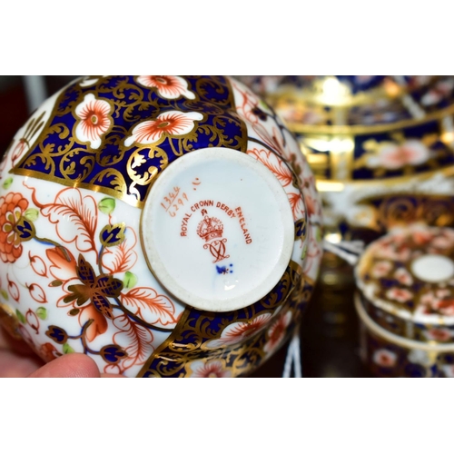 379 - A SMALL GROUP OF ROYAL CROWN DERBY, comprising three Imari pattern items, all with restoration or da... 