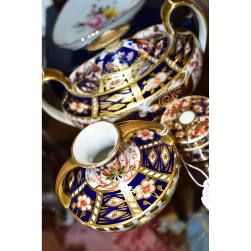 379 - A SMALL GROUP OF ROYAL CROWN DERBY, comprising three Imari pattern items, all with restoration or da... 