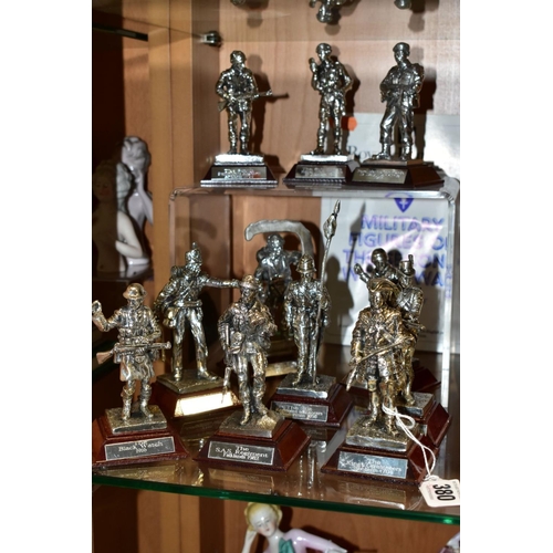 380 - ELEVEN ROYAL HAMPSHIRE PEWTER MILITARY FIGURES, ten boxed, all with titled wooden plinths, including... 