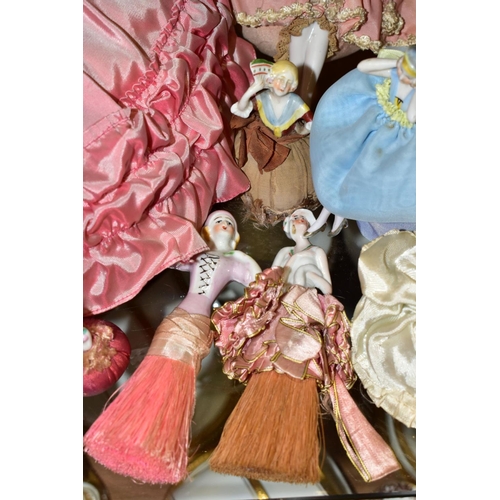 382 - A COLLECTION OF SIXTEEN LATE/EARLY 20TH CENTURY PORCELAIN HALF-DOLLS, including two dressing table b... 