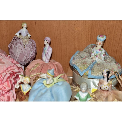 382 - A COLLECTION OF SIXTEEN LATE/EARLY 20TH CENTURY PORCELAIN HALF-DOLLS, including two dressing table b... 