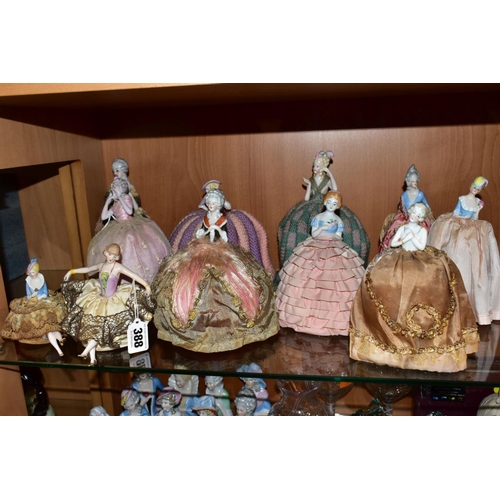 388 - ELEVEN LATE 19TH/EARLY 20TH CENTURY PORCELAIN HALF-DOLL TEA COSIES, PIN CUSHIONS, HAT PINS CUSHIONS,... 