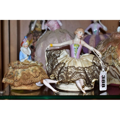 388 - ELEVEN LATE 19TH/EARLY 20TH CENTURY PORCELAIN HALF-DOLL TEA COSIES, PIN CUSHIONS, HAT PINS CUSHIONS,... 