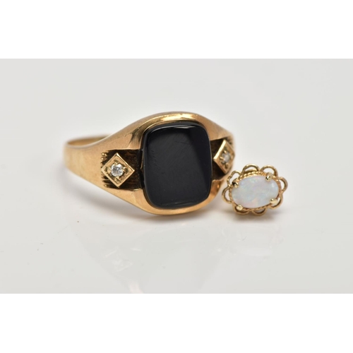 4 - A GENTS 9CT GOLD SIGNET RING, centring on a curved rectangular onyx panel, flanked with circular cut... 