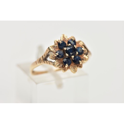 40 - A 9CT GOLD SAPPHIRE CLUSTER DRESS RING, of a flower shape, set with seven circular cut blue sapphire... 