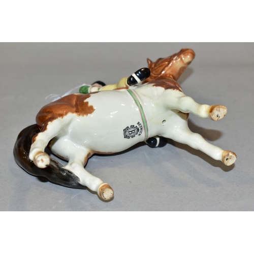 402 - A BESWICK GIRL ON PONY, No 1499, skewbald, Beswick crest backstamp, height 14cm (Condition:- paint r... 