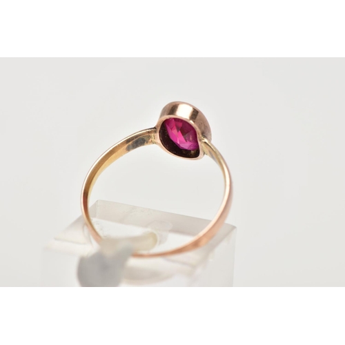 41 - A 22CT GOLD VICTORIAN DRESS RING, set with an oval cut synthetic ruby within a collet mount, plain p... 